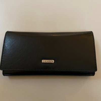 Zoom bild av svart damplånbok